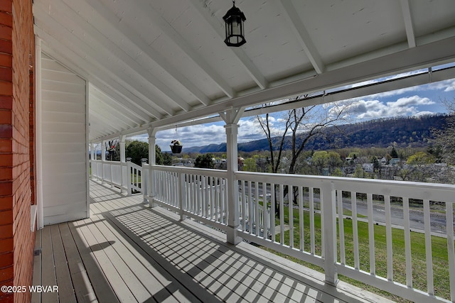 wooden terrace with a mountain view