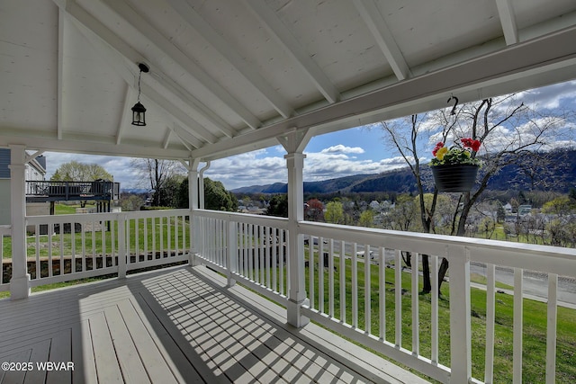 wooden terrace with a mountain view