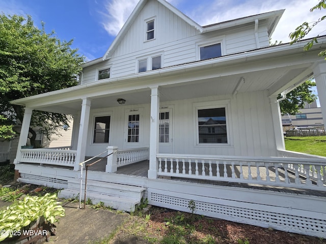 1013 Allegheny St, Jersey Shore, PA 17740 - view of front facade featuring covered porch and board and batten siding