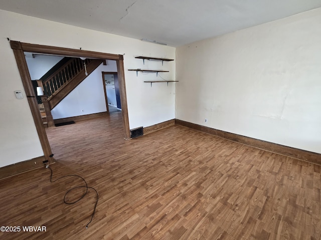 1013 Allegheny St, Jersey Shore, PA 17740 - unfurnished living room with wood finished floors, stairs, and baseboards