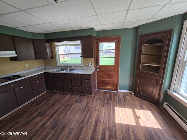 1013 Allegheny St, Jersey Shore, PA 17740 - kitchen with baseboard heating, black electric stovetop, a sink, under cabinet range hood, and a drop ceiling