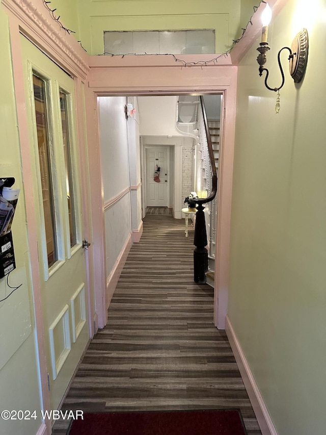 hallway with dark hardwood / wood-style floors