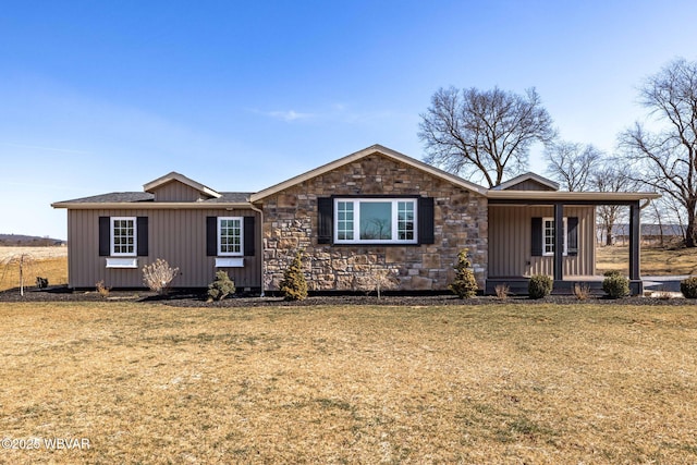 ranch-style home with board and batten siding, a front lawn, covered porch, and stone siding