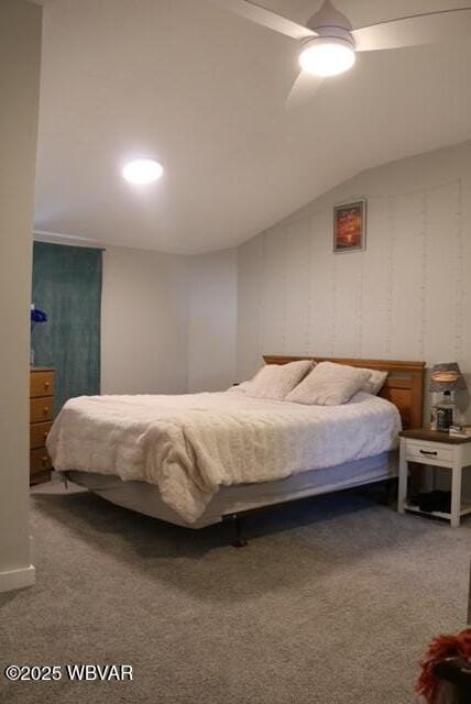 bedroom with carpet floors and lofted ceiling