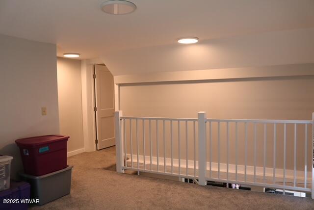 hall featuring carpet