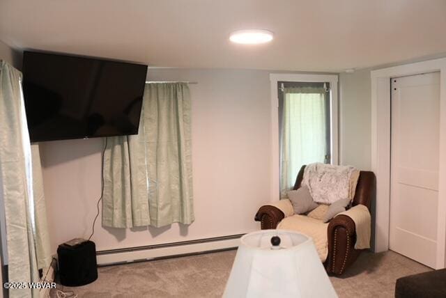 carpeted bedroom featuring baseboard heating