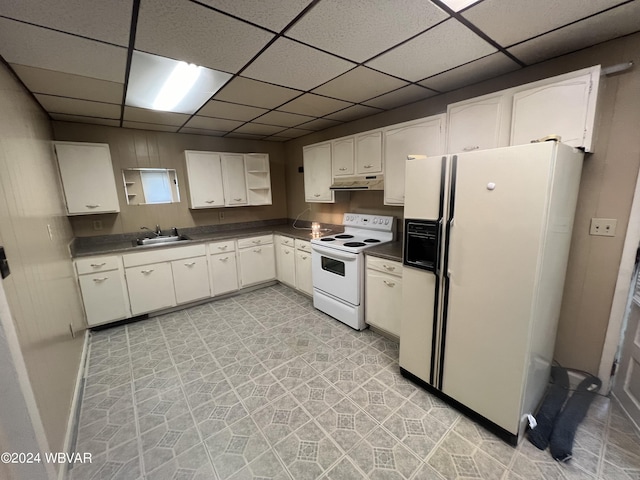 kitchen featuring a drop ceiling, white cabinetry, white appliances, and sink