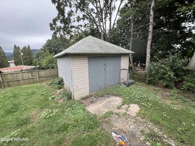 view of outdoor structure with a lawn