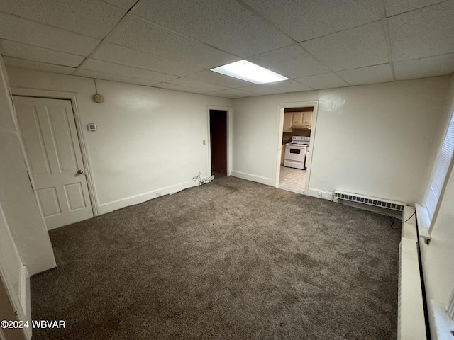 interior space featuring a paneled ceiling and a baseboard radiator