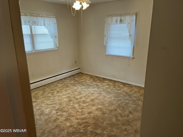 unfurnished room with ceiling fan, carpet floors, and a baseboard radiator