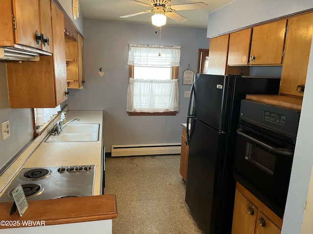 kitchen featuring ceiling fan, baseboard heating, black appliances, and sink