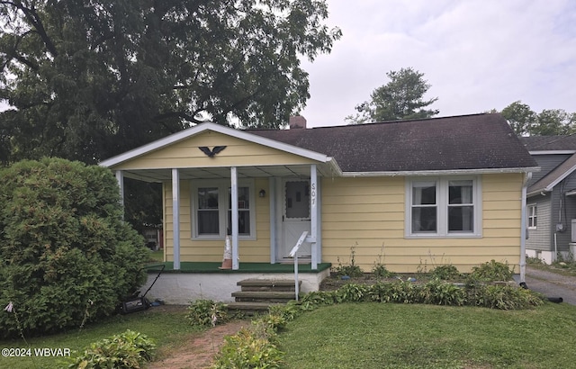 bungalow-style home featuring a front yard and a porch