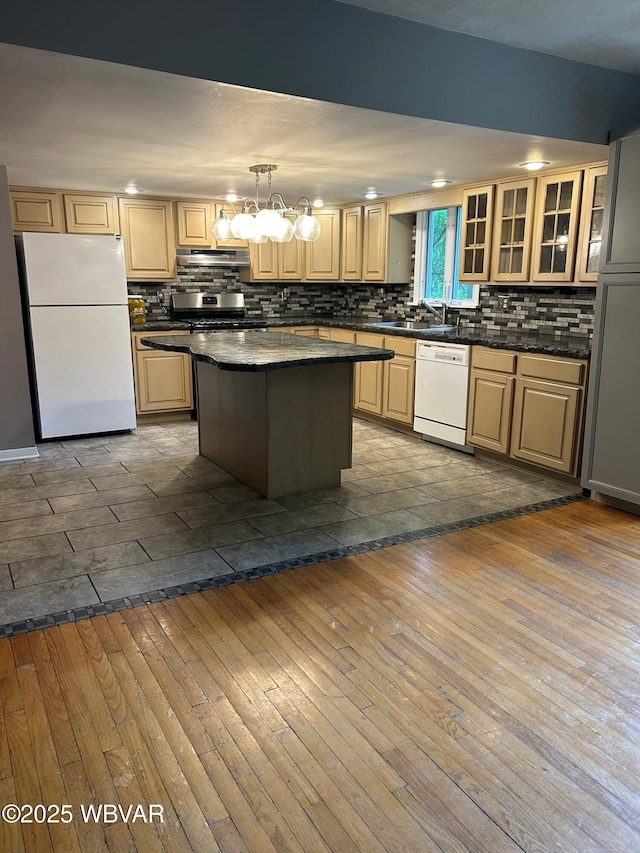 575 Steele Hill Rd, Sugar Run, PA 18846 - kitchen featuring white appliances, under cabinet range hood, dark wood-type flooring, decorative backsplash, and glass insert cabinets