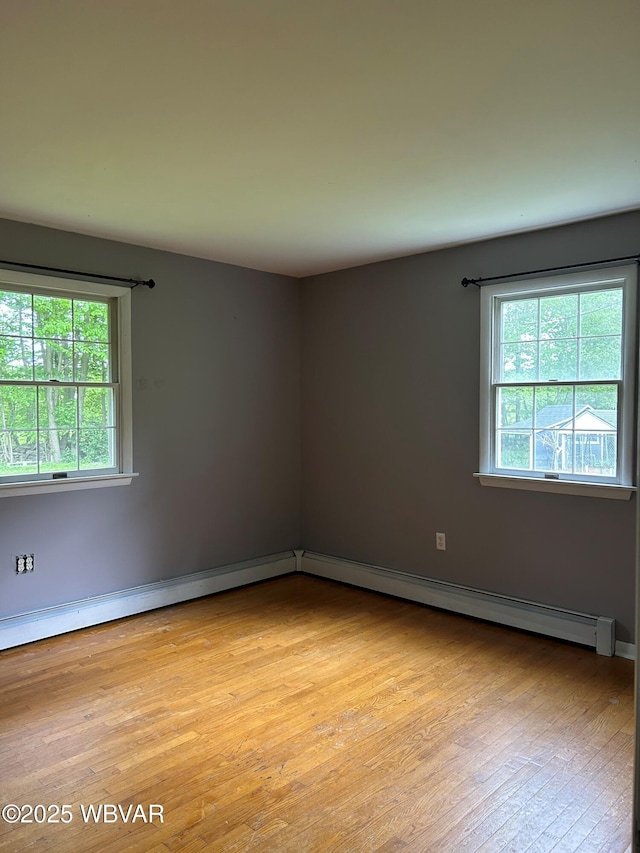 575 Steele Hill Rd, Sugar Run, PA 18846 - unfurnished room featuring light wood-type flooring, a baseboard heating unit, and baseboards