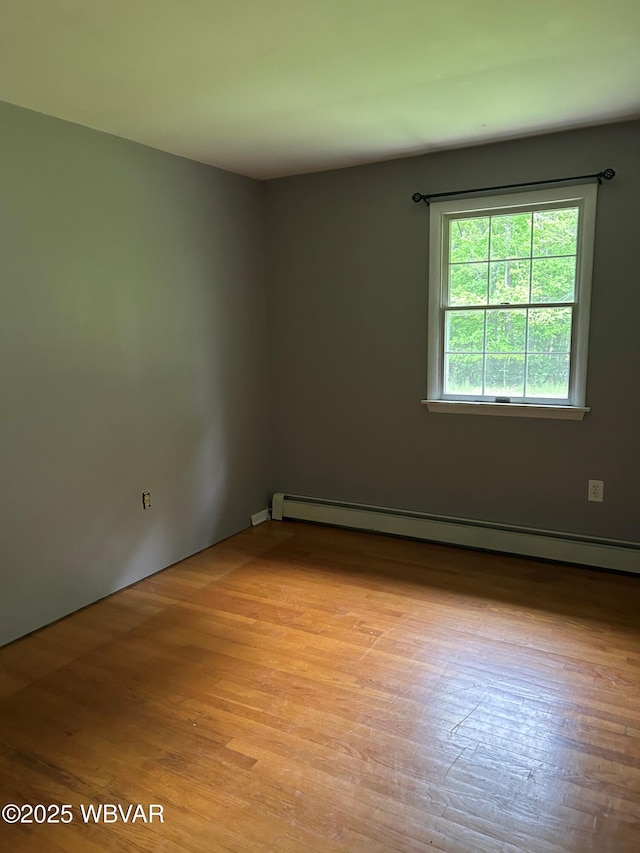 575 Steele Hill Rd, Sugar Run, PA 18846 - unfurnished room featuring a baseboard radiator and light wood-style floors