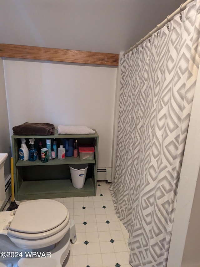 bathroom featuring toilet, tile patterned floors, and baseboard heating