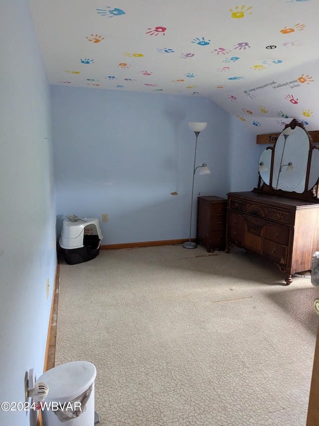 carpeted bedroom with vaulted ceiling