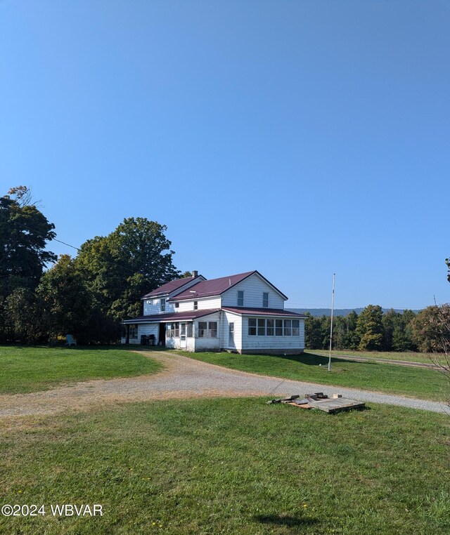 view of front of home with a front yard