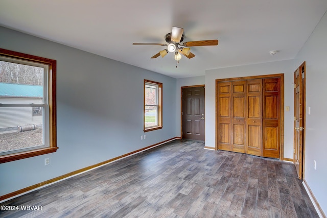 unfurnished bedroom featuring hardwood / wood-style floors and ceiling fan