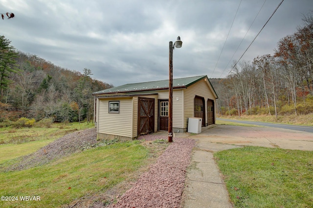 view of outdoor structure with a garage