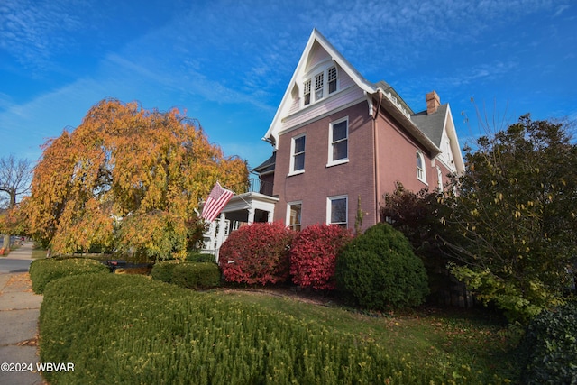 view of home's exterior with a yard