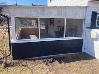 exterior space featuring a sunroom