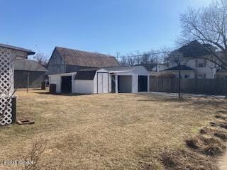 exterior space with an outdoor structure and fence