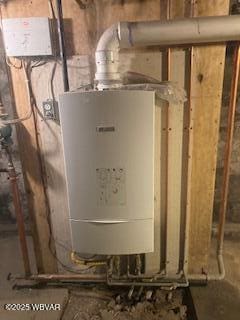 utility room featuring water heater