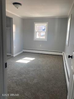 unfurnished room with speckled floor, baseboards, and crown molding