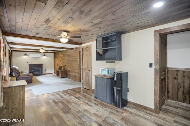 4792 Muncy Exchange Rd, Turbotville, PA 17772 - living room featuring a wooden ceiling with exposed beams, ceiling fan, a wall mounted AC, wood walls, and light wood-type flooring