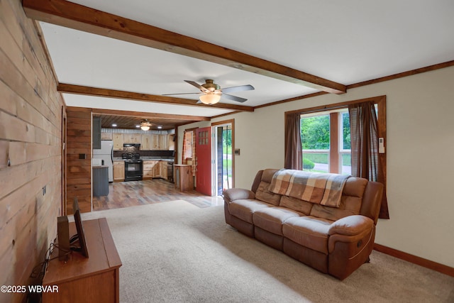 4792 Muncy Exchange Rd, Turbotville, PA 17772 - living room featuring beamed ceiling, light carpet, ceiling fan, and wood walls