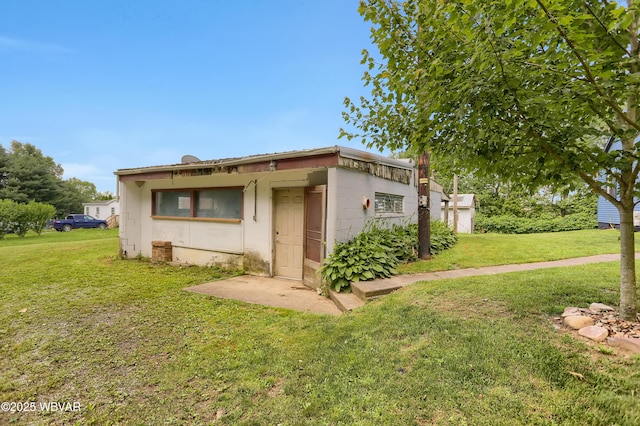 4792 Muncy Exchange Rd, Turbotville, PA 17772 - view of side of property featuring concrete block siding and a yard