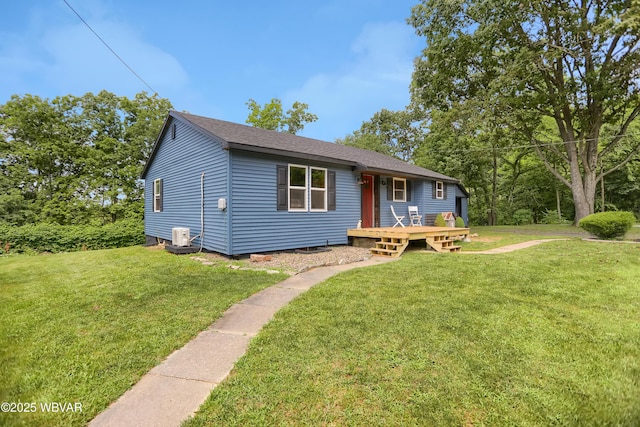 4792 Muncy Exchange Rd, Turbotville, PA 17772 - view of front of house featuring a front yard, a wooden deck, and roof with shingles