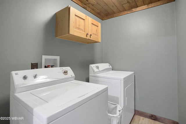 4792 Muncy Exchange Rd, Turbotville, PA 17772 - laundry room with cabinet space, wooden ceiling, independent washer and dryer, and light wood-type flooring