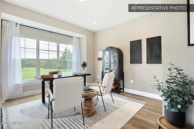 dining area with hardwood / wood-style flooring