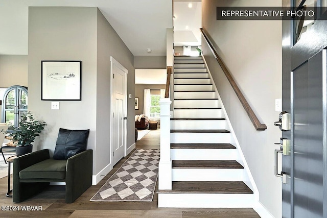 stairway with wood-type flooring