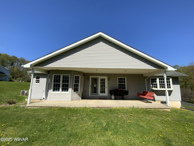 32 Chestnut Ct, Jersey Shore, PA 17740 - rear view of house with a lawn and a patio