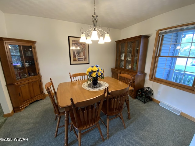 32 Chestnut Ct, Jersey Shore, PA 17740 - carpeted dining room featuring baseboards, visible vents, and an inviting chandelier