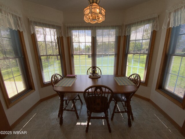 32 Chestnut Ct, Jersey Shore, PA 17740 - tiled dining area with baseboards and a wealth of natural light