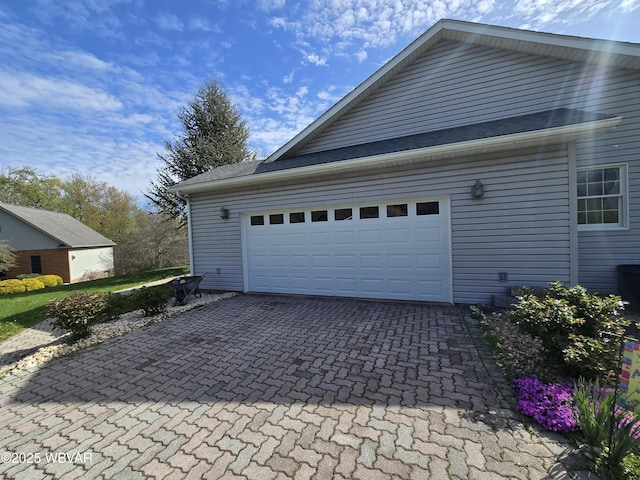 32 Chestnut Ct, Jersey Shore, PA 17740 - garage featuring decorative driveway