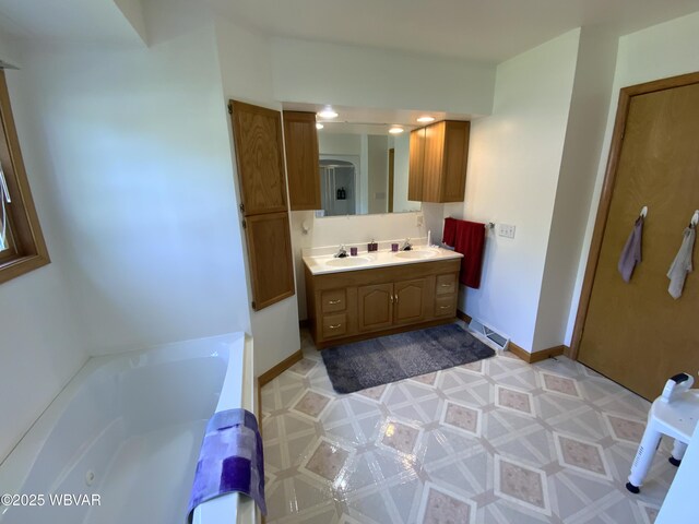 32 Chestnut Ct, Jersey Shore, PA 17740 - full bathroom featuring double vanity, a bath, a stall shower, a sink, and tile patterned floors