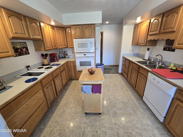 32 Chestnut Ct, Jersey Shore, PA 17740 - kitchen featuring a sink, light countertops, brown cabinetry, and white appliances
