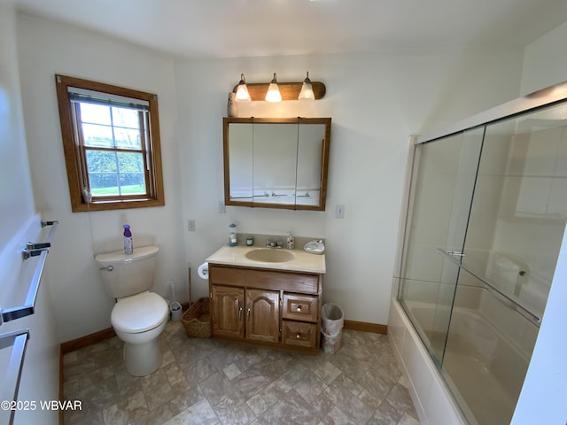 32 Chestnut Ct, Jersey Shore, PA 17740 - bathroom featuring vanity, baseboards, combined bath / shower with glass door, and toilet