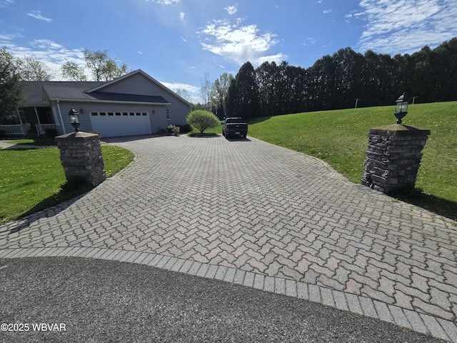 32 Chestnut Ct, Jersey Shore, PA 17740 - view of home's exterior with a lawn, decorative driveway, and a garage