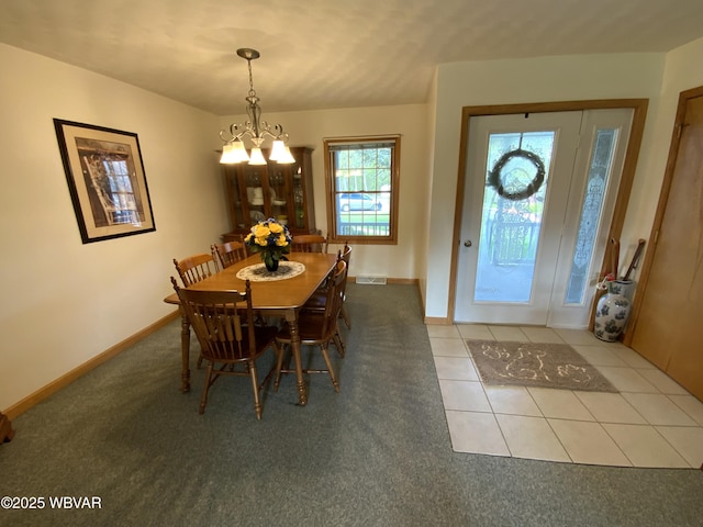 32 Chestnut Ct, Jersey Shore, PA 17740 - tiled dining space featuring carpet floors, baseboards, and a notable chandelier