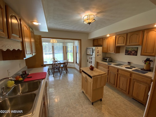 32 Chestnut Ct, Jersey Shore, PA 17740 - kitchen with freestanding refrigerator and a sink