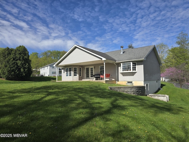 32 Chestnut Ct, Jersey Shore, PA 17740 - back of property featuring a lawn, roof with shingles, and a patio area