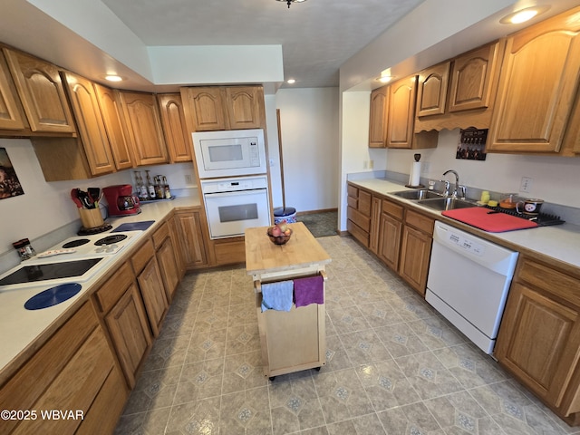 32 Chestnut Ct, Jersey Shore, PA 17740 - kitchen with a sink, light countertops, brown cabinetry, and white appliances