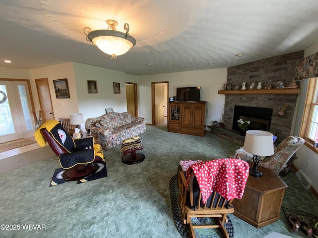 32 Chestnut Ct, Jersey Shore, PA 17740 - carpeted living area featuring visible vents and a fireplace