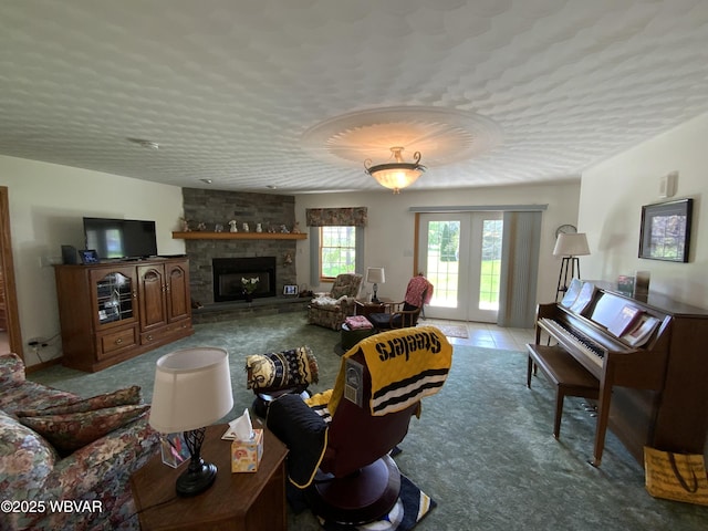32 Chestnut Ct, Jersey Shore, PA 17740 - living room with carpet floors, a textured ceiling, a stone fireplace, and french doors
